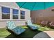 Inviting backyard featuring lounge chairs and artificial turf, perfect for outdoor relaxation and entertaining at 9625 W Meranto Ave, Las Vegas, NV 89178