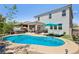 Enjoy this outdoor oasis with a pool, hot tub, patio, and well-manicured landscaping at 9625 W Meranto Ave, Las Vegas, NV 89178