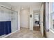 Bathroom featuring a glass shower enclosure and access to the Primary bedroom at 9625 W Meranto Ave, Las Vegas, NV 89178