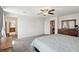 Spacious bedroom showcasing neutral carpet and access to the en suite bathroom at 9625 W Meranto Ave, Las Vegas, NV 89178