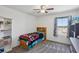 Bedroom includes a ceiling fan and plush carpet with a window view at 9625 W Meranto Ave, Las Vegas, NV 89178