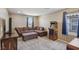 Cozy bonus room with a large sectional sofa, perfect for relaxation and entertainment at 9625 W Meranto Ave, Las Vegas, NV 89178