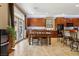 Spacious dining area with a wooden table, seamlessly connected to the modern kitchen, creating an inviting space at 9625 W Meranto Ave, Las Vegas, NV 89178