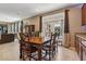 Bright dining area with access to the outdoor pool area through glass doors and backyard views at 9625 W Meranto Ave, Las Vegas, NV 89178