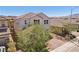 Beautiful two-story home with a well-maintained front yard, a paved driveway, and a charming facade at 9625 W Meranto Ave, Las Vegas, NV 89178