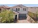 Charming two-story home with a well-manicured front yard, a paved driveway, and a welcoming entrance at 9625 W Meranto Ave, Las Vegas, NV 89178