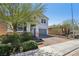 View of a two-story home with brick driveway and desert landscaping at 9625 W Meranto Ave, Las Vegas, NV 89178