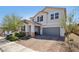 Two-story home featuring a brick driveway and a two-car attached garage at 9625 W Meranto Ave, Las Vegas, NV 89178