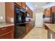 Charming kitchen features ample cabinet space and granite countertops at 9625 W Meranto Ave, Las Vegas, NV 89178