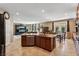 Modern kitchen island with seating, granite countertops, and stainless steel appliances in an open-concept design at 9625 W Meranto Ave, Las Vegas, NV 89178