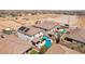 An elevated view shows a backyard with a pool, covered patio and desert landscaping at 9625 W Meranto Ave, Las Vegas, NV 89178
