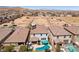 Aerial view of a well-maintained backyard featuring a pool, covered patio, and desert landscape at 9625 W Meranto Ave, Las Vegas, NV 89178