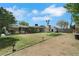 Expansive backyard with a mix of grass and desert landscaping, along with a patio at 1041 E Saint Louis Ave, Las Vegas, NV 89104
