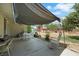 Backyard area featuring an outdoor dining setup and landscaping at 1041 E Saint Louis Ave, Las Vegas, NV 89104