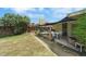 A well-kept backyard features a lush lawn and a patio area, ideal for outdoor dining and entertaining at 1041 E Saint Louis Ave, Las Vegas, NV 89104