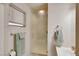 The bathroom features a glass shower enclosure, a window for natural light, and a towel rack at 1041 E Saint Louis Ave, Las Vegas, NV 89104