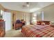 Bedroom with large bed, plaid bedding and natural light at 1041 E Saint Louis Ave, Las Vegas, NV 89104
