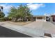 Charming single-story home featuring a spacious front yard and a long private driveway at 1041 E Saint Louis Ave, Las Vegas, NV 89104