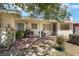Inviting front porch with brick flooring, comfortable seating, and a cozy, welcoming atmosphere at 1041 E Saint Louis Ave, Las Vegas, NV 89104