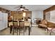 Cozy living room featuring a fireplace, wood paneled walls, and comfortable seating at 1041 E Saint Louis Ave, Las Vegas, NV 89104