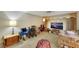 Bright living room featuring a large lamp, a TV, and several wheelchairs at 1041 E Saint Louis Ave, Las Vegas, NV 89104
