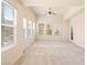 Spacious, carpeted living room with plenty of natural light from many windows at 10550 W Alexander Rd # 2017, Las Vegas, NV 89129