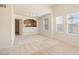 Inviting living room featuring neutral decor, carpet, and a view of the kitchen at 10550 W Alexander Rd # 2017, Las Vegas, NV 89129