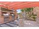 Outdoor kitchen includes a grill and countertop, with space for outdoor seating at 10550 W Alexander Rd # 2017, Las Vegas, NV 89129