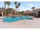 Beautiful outdoor pool area with palm trees, various seating options and spa at 10550 W Alexander Rd # 2017, Las Vegas, NV 89129
