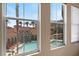 Windows frame views of the sparkling community pool, palm trees, and other resort-style amenities at 10550 W Alexander Rd # 2017, Las Vegas, NV 89129