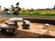 Stone tiled backyard patio set with a serene view of the neighborhood at 1160 Golf Club, Laughlin, NV 89029
