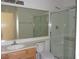 Bathroom featuring a single sink vanity, large mirror, and glass enclosed shower at 1160 Golf Club, Laughlin, NV 89029