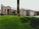 Single-story home with a two car garage and lush green lawn in the front yard at 1160 Golf Club, Laughlin, NV 89029