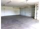 Spacious garage with multiple garage door access and concrete flooring at 1160 Golf Club, Laughlin, NV 89029
