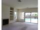 Open-concept living room, complete with built-in shelves and a sliding glass door at 1160 Golf Club, Laughlin, NV 89029
