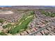 Wide aerial view of a community, with a golf course winding through neatly arranged homes at 1264 Olivia Pkwy, Henderson, NV 89011