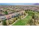 Aerial view of a neighborhood near a golf course, showcasing the community's location and amenities at 1264 Olivia Pkwy, Henderson, NV 89011