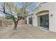 View of the home's backyard with desert landscaping and sliding door entry at 1264 Olivia Pkwy, Henderson, NV 89011