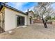 Low-maintenance backyard with gravel landscaping, covered patio, and stucco exterior at 1264 Olivia Pkwy, Henderson, NV 89011