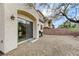 View of the home's backyard with a grill, brick wall and desert landscaping at 1264 Olivia Pkwy, Henderson, NV 89011