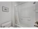 Clean and functional bathroom with a tub and shower combination and white tiling at 1264 Olivia Pkwy, Henderson, NV 89011