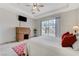 This bedroom features sliding doors, a ceiling fan, and a desk at 1264 Olivia Pkwy, Henderson, NV 89011