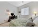 Inviting bedroom featuring a dedicated workspace and comfortable sleeping area at 1264 Olivia Pkwy, Henderson, NV 89011