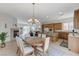 Open-concept space showcasing a dining area and kitchen with modern finishes and comfortable seating at 1264 Olivia Pkwy, Henderson, NV 89011