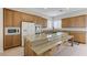 Bright kitchen with a large center island, granite counters, and plentiful cabinet storage at 1264 Olivia Pkwy, Henderson, NV 89011