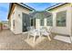 View of the home's backyard patio with desert landscaping at 1264 Olivia Pkwy, Henderson, NV 89011