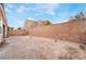Large backyard that features a brick wall fence for privacy and an open space for entertaining at 1273 Olivia Parkway Pkwy, Henderson, NV 89011