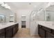 Large bathroom featuring double sinks, glass shower, and walk-in closet at 1273 Olivia Parkway Pkwy, Henderson, NV 89011