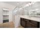 Modern bathroom with double vanity, glass shower, and walk-in closet at 1273 Olivia Parkway Pkwy, Henderson, NV 89011