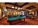 Billiard room featuring multiple pool tables, stylish lighting and comfortable seating at 1273 Olivia Parkway Pkwy, Henderson, NV 89011